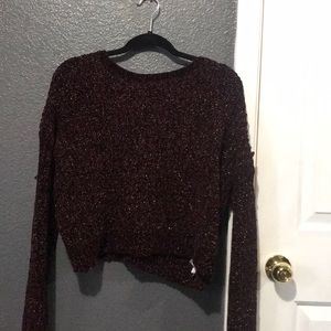 Knitted sweater.